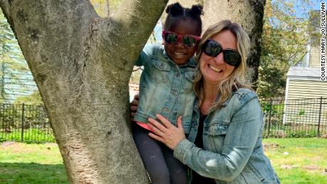 Mary-Jo Sullivan with her adopted daughter, Gracie, from Haiti.