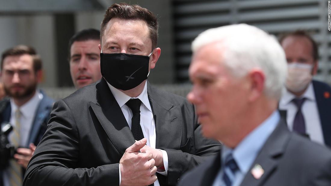&lt;a href=&quot;https://www.cnn.com/2020/05/13/us/gallery/elon-musk/index.html&quot; target=&quot;_blank&quot;&gt;SpaceX founder Elon Musk&lt;/a&gt; wears a face mask while standing next to Vice President Mike Pence.