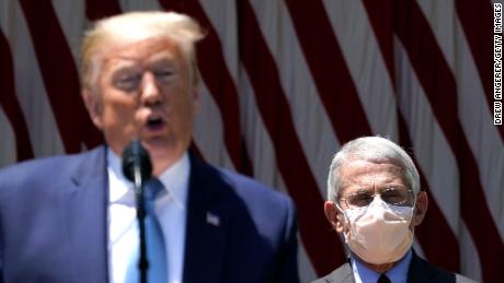 President Donald Trump is flanked by Dr. Anthony Fauci, director of the National Institute of Allergy and Infectious Diseases while speaking about coronavirus vaccine at White House in May.