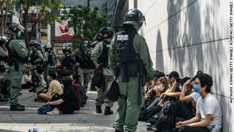 Riot police mass detain pro-democracy protesters during a rally in Causeway Bay district on May 27 in Hong Kong.