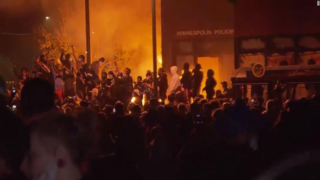 A Minneapolis police precinct is burning during a second night of protests over the death of George Floyd