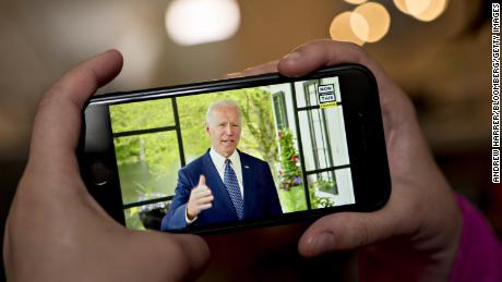 Former Vice President Joe Biden, presumptive Democratic presidential nominee, speaks during a NowThis economic address seen on a smartphone in Arlington, Virginia, 