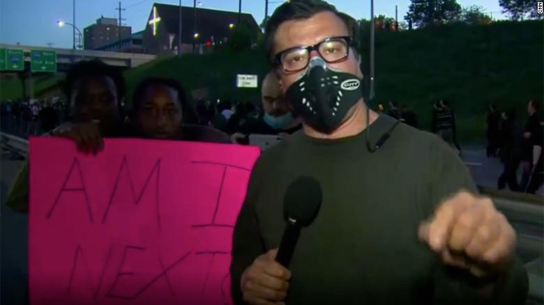 A protester in Minneapolis asks a question many in the crowd have.