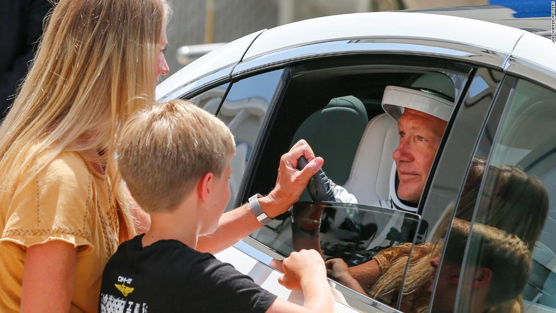 Hurley says goodbye to his wife and son before the launch on May 30.