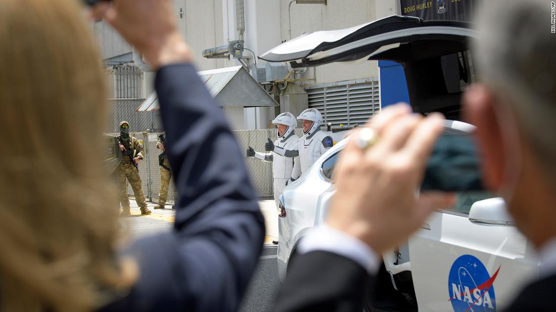 Hurley and Behnken walk out of the Neil Armstrong Operations and Checkout Building on May 30.