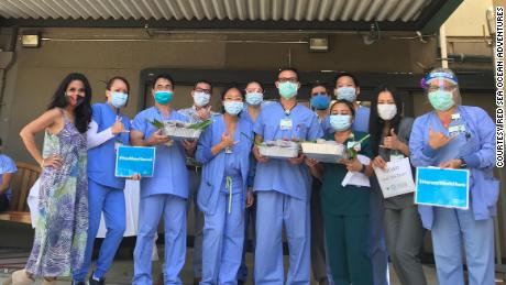 Healthcare workers at the Straub Medical Center with the donated tuna poke bowls.