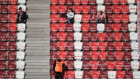 Fans of home side DVTK wait before the start of its home Hungarian league match against Mezokovesd.
