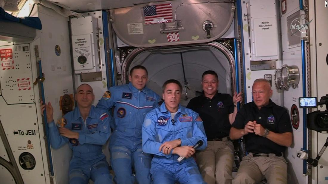 US astronauts disembark SpaceX's Crew Dragon and board the International Space Station