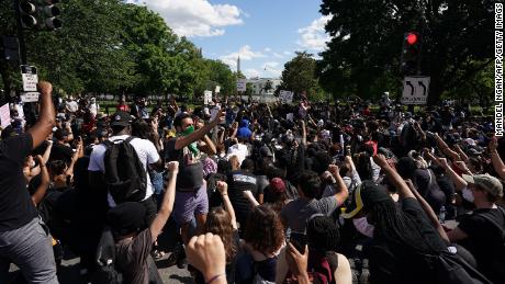 Demonstrators gather near the White House on Sunday.