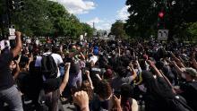 Demonstrators gather near the White House on Sunday.