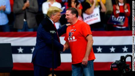 President Donald Trump shakes hands with Minneapolis Police Union head Bob Kroll on stage during a campaign rally at the Target Center on October 10, 2019 in Minneapolis, Minnesota. 