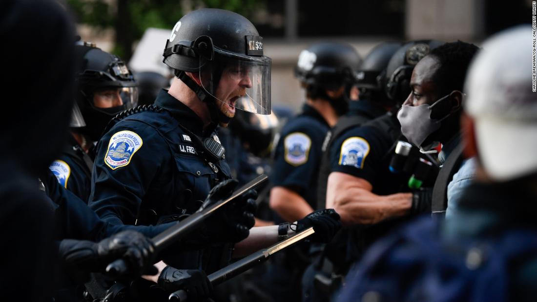 Police react to demonstrators near the White House on May 31.