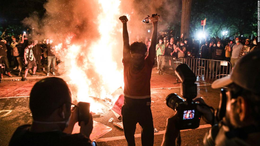 Protesters burn materials during a protest in Washington, DC, early on June 1.