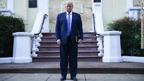 US President Donald Trump holds up a bible in front of boarded up St John&#39;s Episcopal church after walking across Lafayette Park from the White House in Washington, DC on June 1, 2020. - US President Donald Trump was due to make a televised address to the nation on Monday after days of anti-racism protests against police brutality that have erupted into violence.
The White House announced that the president would make remarks imminently after he has been criticized for not publicly addressing in the crisis in recent days. (Photo by Brendan Smialowski / AFP) / ALTERNATE CROP (Photo by BRENDAN SMIALOWSKI/AFP via Getty Images)
