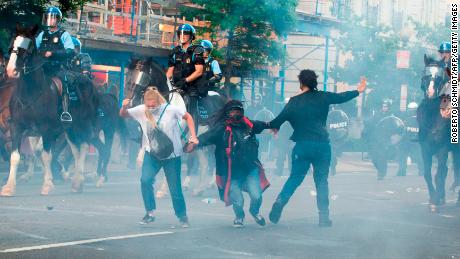 Protestors are tear gassed as the police disperse them near the White House on June 1, 2020.