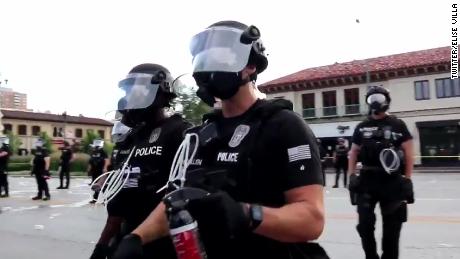 Video appears to show police pepper spraying yelling protester