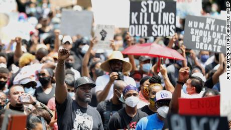 People join George Floyd&#39;s relatives in a march in Houston.