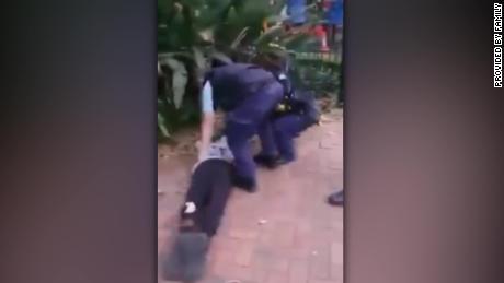 An Australian police officer trips and throws a 17-year-old Indigenous boy to the ground.