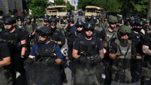 Police and security forces on H St block access to 16th St northwest of Lafayette Square near the White House, during protests over the death of George Floyd on June 3, 2020, in Washington, DC. 