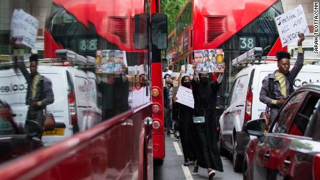 Protesters moved between stopped buses and cars and the protest moved through central London.