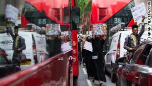 Protesters moved between stopped buses and cars and the protest moved through central London.