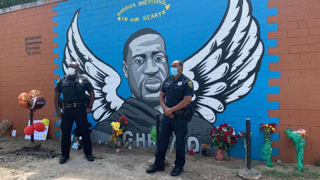 Houston police officers pay their respects to George Floyd at a ...