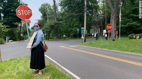 Mallory Corr took this photo of her friend, Elizabeth Lucy, holding a sign with the names of seven black Americans who died at the hands of police.