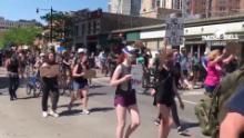 Protesters - some wearing medical masks - march following the death of George Floyd in police custody.