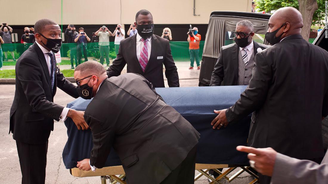 Floyd&#39;s casket is moved ahead of the service.