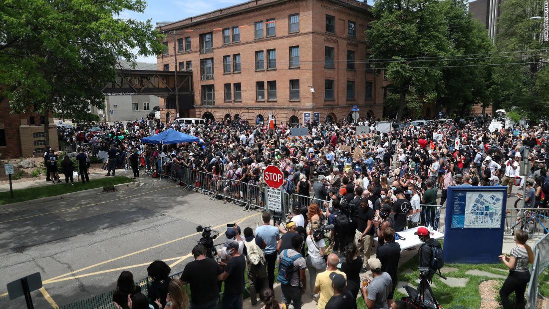 People gather outside the service.