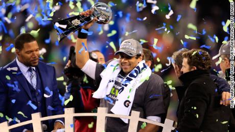 Wilson celebrates with the Vince Lombardi trophy after defeating the Denver Broncos 43-8 in Super Bowl XLVIII in 2014. 