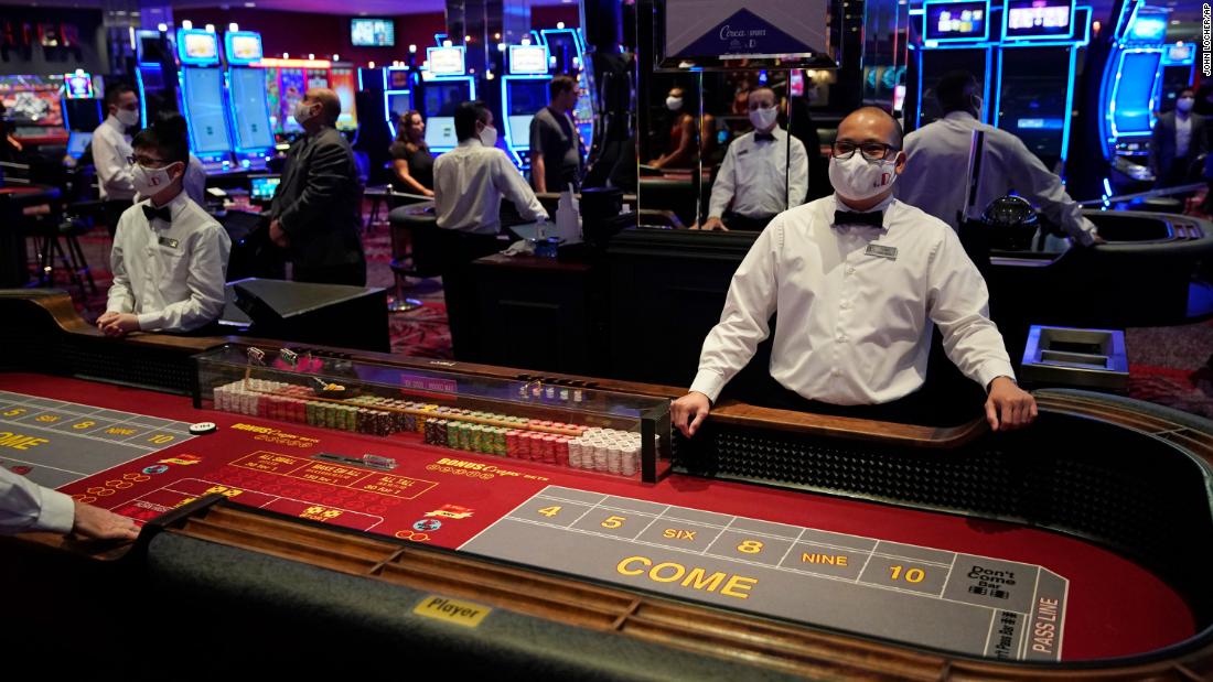 Dealers wear masks just before the reopening of the D Hotel and Casino in Las Vegas.