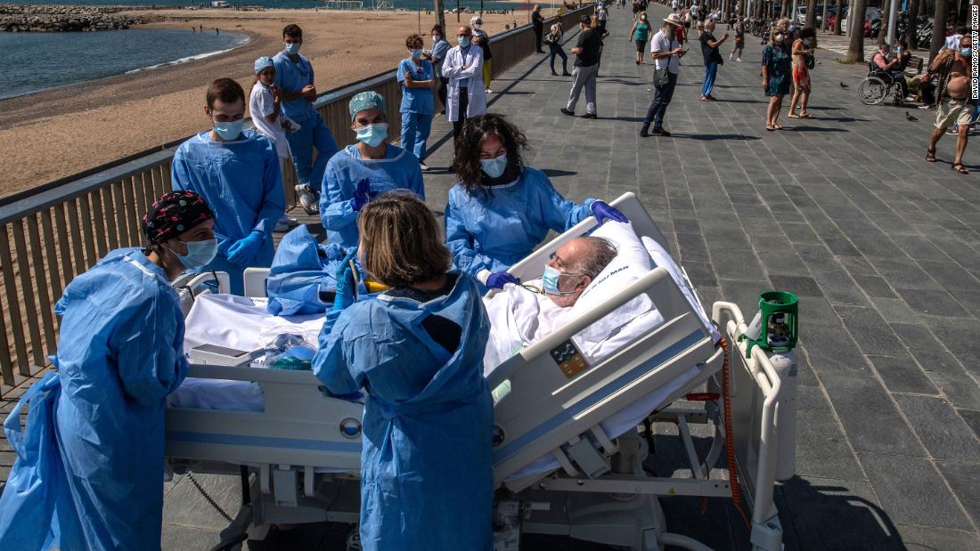 Isidre Correa, who is recovering from the coronavirus, is taken to the seaside in Barcelona, Spain, on June 3, 2020. Hospital del Mar has been taking patients to the seaside as part of the recovery process.