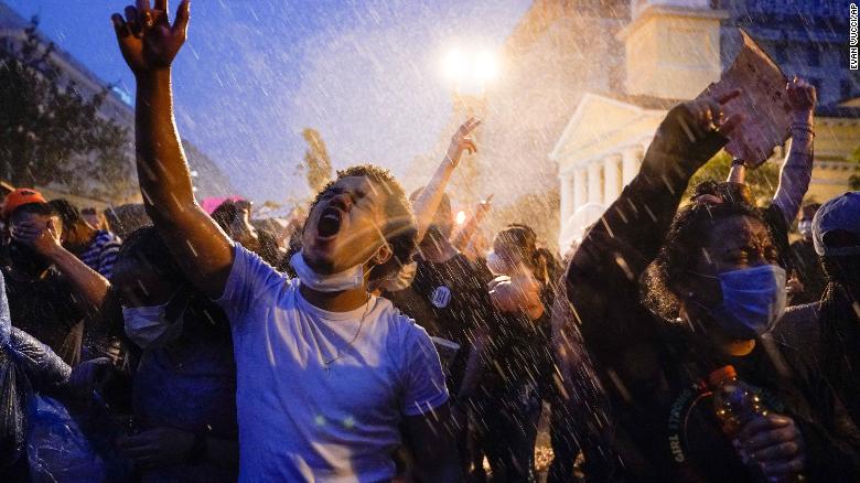 Demonstrators protest, Thursday, June 4, 2020, near the White House in Washington