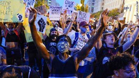 Demonstrators protest Thursday near the White House in Washington.