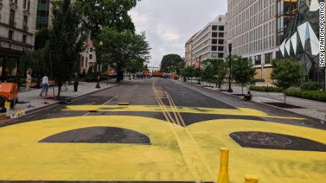 City workers began painting &quot;black lives matter&quot; in yellow paint on Friday on 16th Street in Washington, D.C.