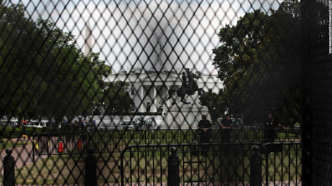 The White House is seen behind temporary metal fencing that was installed to keep protesters further back.