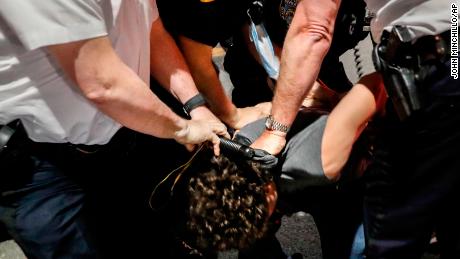 Police arrest a protester on Fifth Avenue during a march in Manhattan.