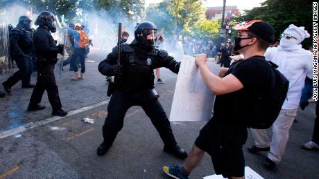 Police clash with protesters near the White House on Monday at a demonstration against the killing of George Floyd.