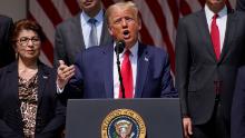 President Donald Trump speaks during a news conference in the Rose Garden of the White House, Friday, June 5, 2020, in Washington. Front row from left, Small Business Administration administrator Jovita Carranza, Trump, and Vice President Mike Pence. Back row from left, member of Council of Economic Advisers Tyler Goodspeed, Labor Secretary Eugene Scalia, Treasury Secretary Steven Mnuchin, and Chairman of the Council of Economic Advisers Tomas Philipson.(AP Photo/Evan Vucci)