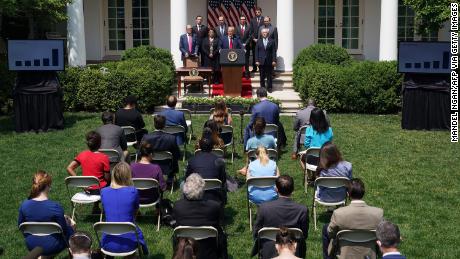 US President Donald Trump, with Director of the National Economic Council Larry Kudlow (L), holds a press conference on the economy, in the Rose Garden of the White House in Washington, DC, on June 5, 2020. - The US economy regained 2.5 million jobs in May as coronavirus pandemic shutdowns began to ease, sending the unemployment rate falling to 13.3 percent, the Labor Department reported on June 5. (Photo by MANDEL NGAN / AFP) (Photo by MANDEL NGAN/AFP via Getty Images)