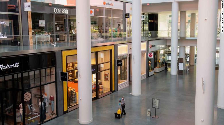 A janitor walks through Brookfield Plaza, a shopping mall in Manhattan's Financial District.