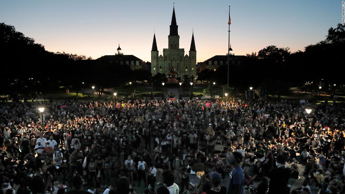 People attend a rally outside Jackson Square in New Orleans on June 5.