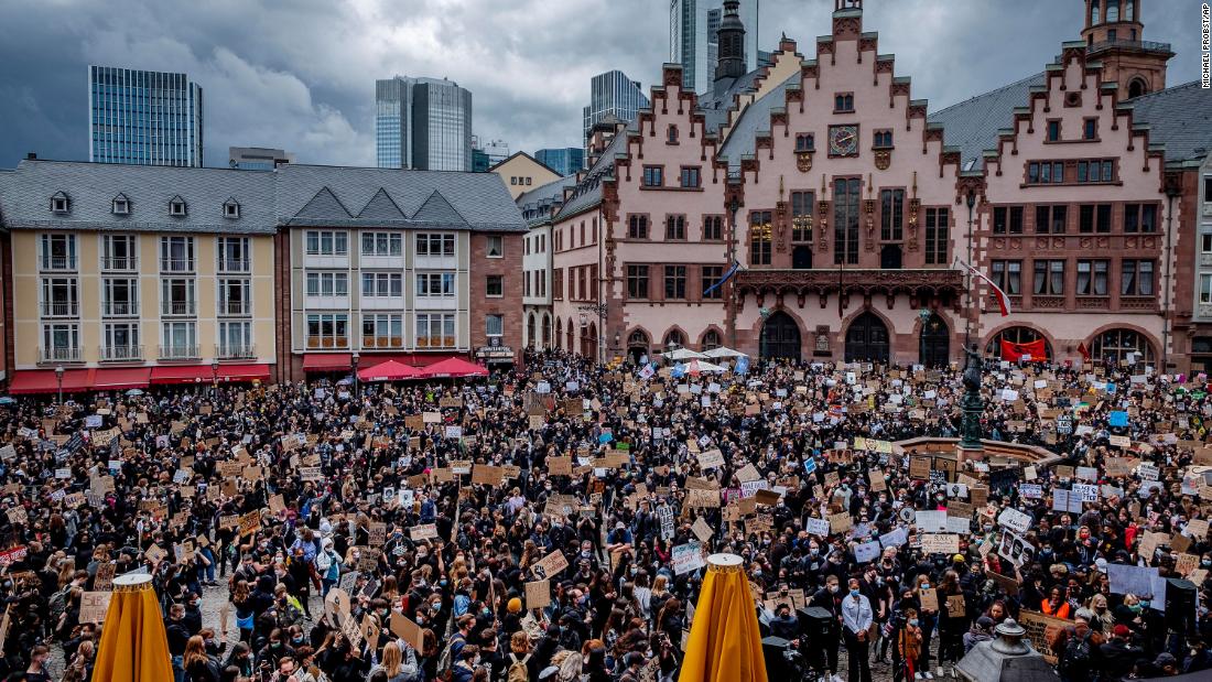 Hundreds of people attend a rally in Frankfurt, Germany, to honor George Floyd.
