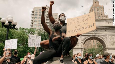 Demonstrators denouncing systemic racism and the police killings of black Americans rally in Washington Square Park on June 6, 2020, in New York City. 