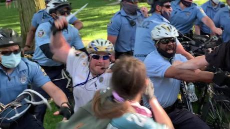 Philadelphia police inspector surrenders to face charges of assaulting student during protest