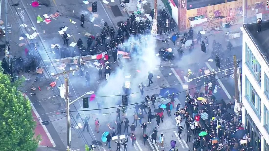 Police in Seattle are clearing protesters with flash bangs