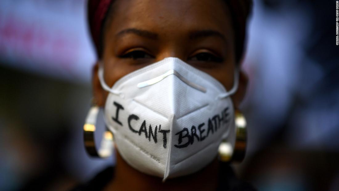 A woman wears a mask during a demonstration in Madrid on June 7.