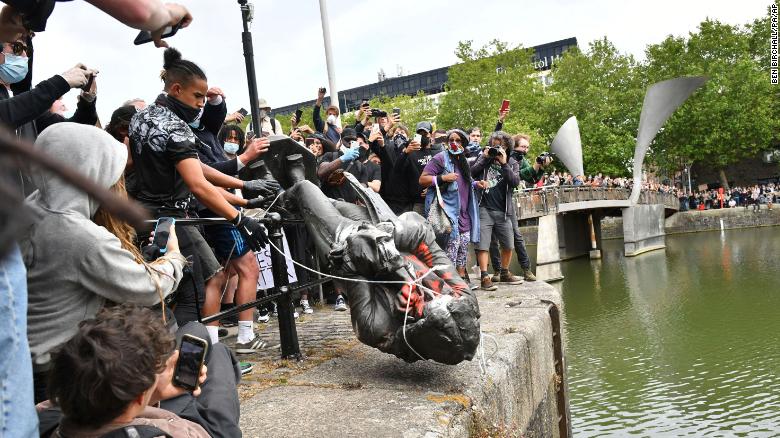 Watch UK protesters tear down statue of slave trader