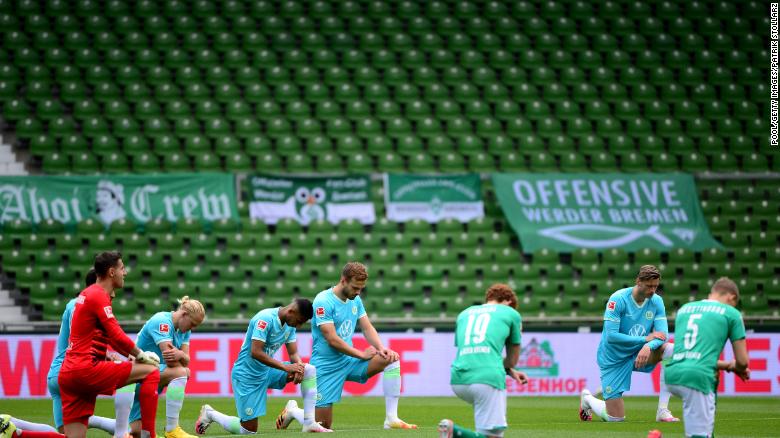 Players from both teams take a knee in protest prior to the Bundesliga match between SV Werder Bremen and VfL Wolfsburg in Germany on Sunday.